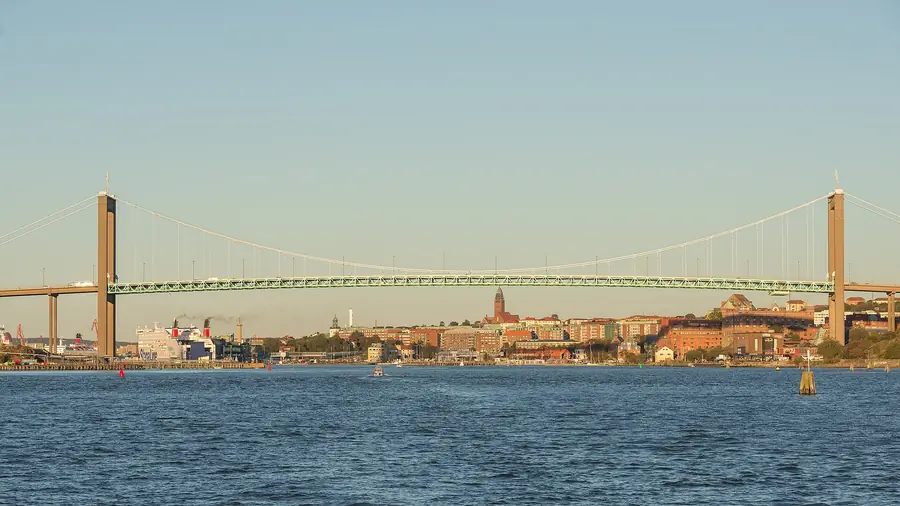The Älvsborg Bridge crossing the entrance to the port of Gothenburg, Sweden, under a clear blue sky